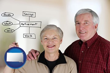 a retired couple reviewing their investments - with South Dakota icon
